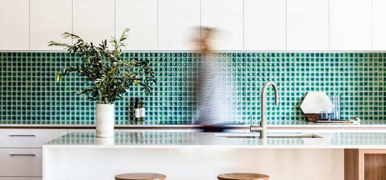 Modern kitchen with green tile splash back