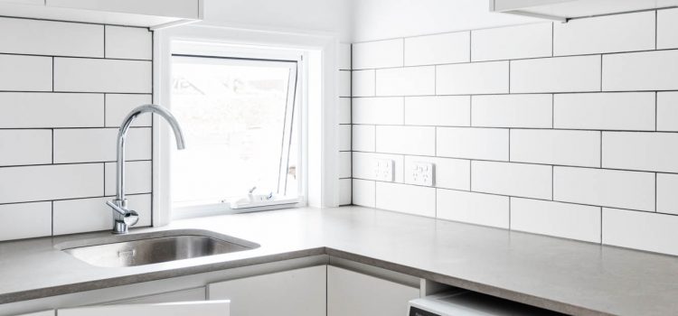 Laundry with subway tile splashback