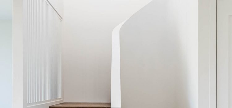 Curved staircase with potten plants